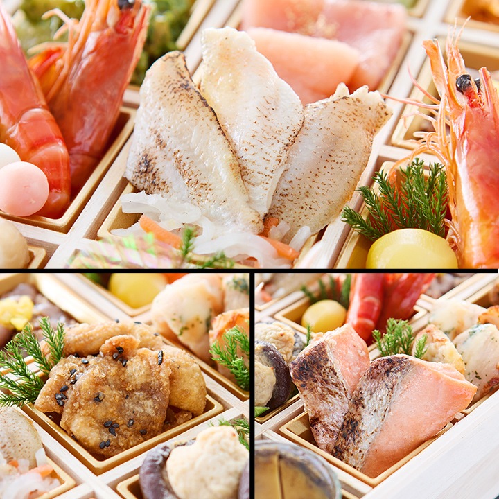 焼いたのどぐろの切り身、有頭の赤い海老、サーモンの焼き物が並ぶおせちのお重