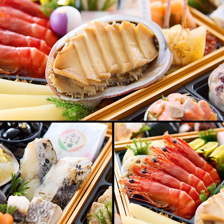 殻つきの特大あわび酒蒸しと、赤い海老、焼き魚のアップ